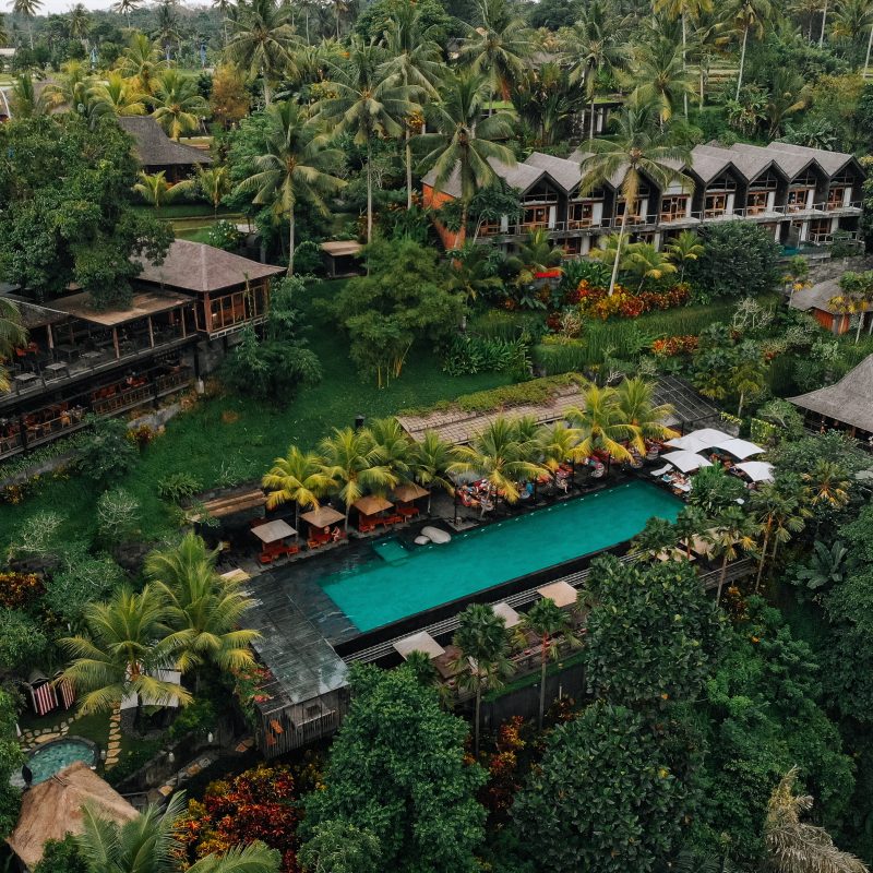 Aerial,view,of,luxury,hotel,with,straw,roof,villas,and