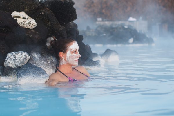 Woman,relaxing,in,geothermal,spa,in,hot,spring,pool,in